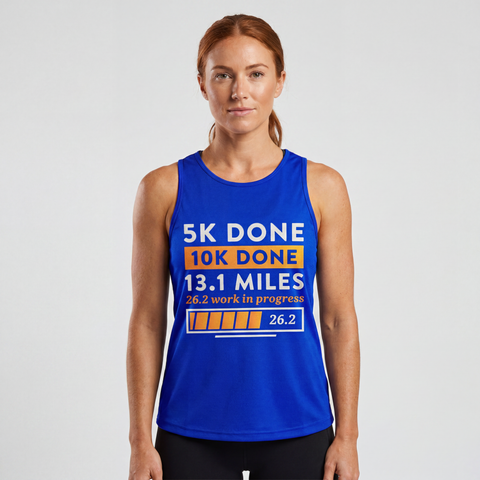 Women's blue marathon training tank top featuring "5K Done, 10K Done, 13.1 Miles, 26.2 Work in Progress" running graphic