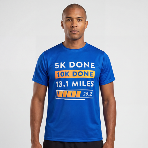 Man wearing blue Marathoner in Training performance t-shirt featuring runner distance progression graphic