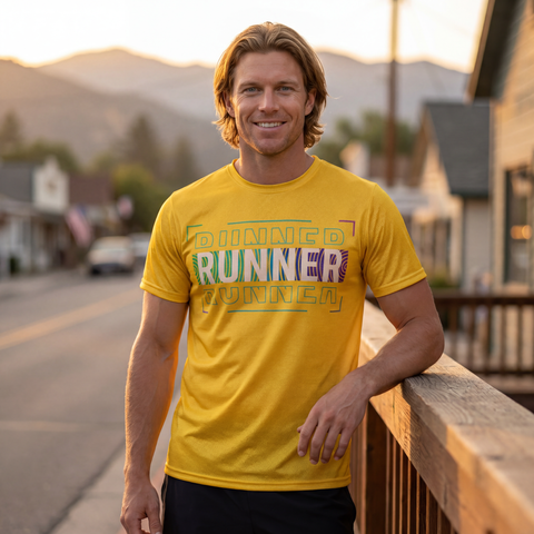 Male runner wearing yellow RUNNER athletic shirt in lifestyle setting